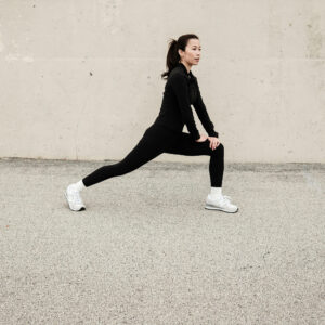 Woman exercising during a strength workout while using GLP-1 weight loss support at a wellness clinic in Overland Park Kansas