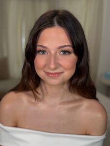 Soft glam bridal makeup in Overland Park Kansas at The Pip Rx, featuring natural glowing skin and polished wedding day beauty.